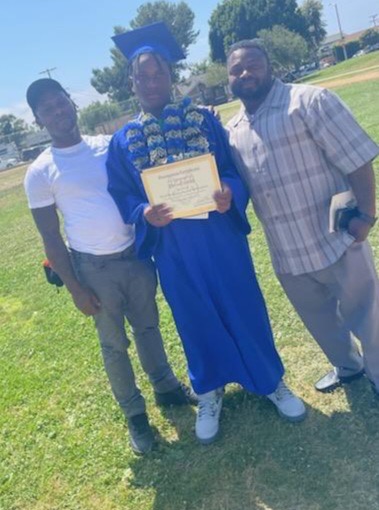 Darrell with youth at graduation ceremony